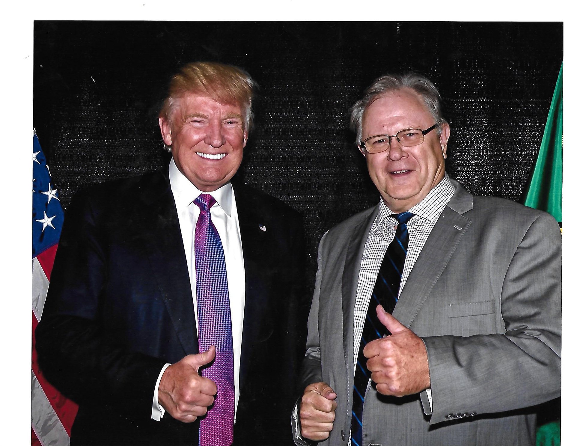 ADA County Commissioner posing with former President Donald Trump